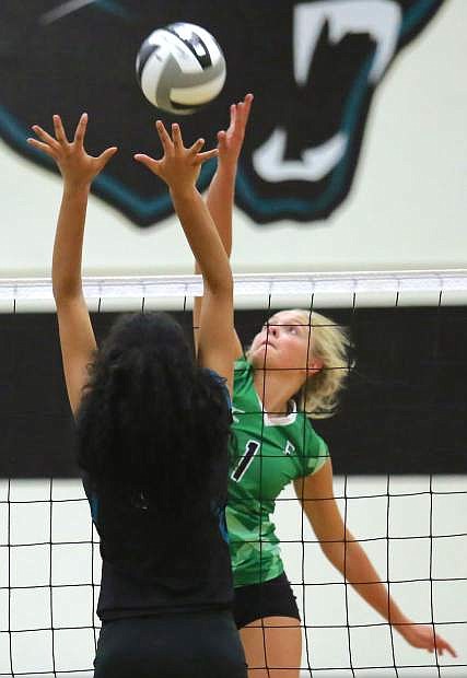 Fallon&#039;s Whitney Skabelund goes high to battle North Valleys in a non-league volleyball match.