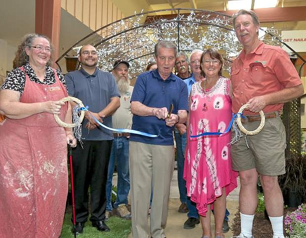 Surrounded by vendors Mayor Bob Crowell cuts the ribbon at the opening of the 2017 Home and Garden Show in the Carson Mall. The show runs all day through the weekend and is free to the public.