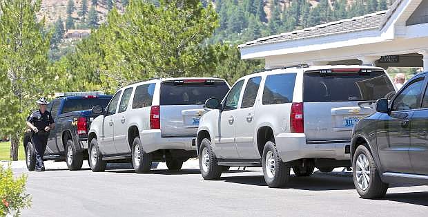 Former President Bill Clinton&#039;s motorcade sits outside the clubhouse at Genoa Lakes Golf Course Wednesday. President Clinton shot 9 holes at the Lakes Course before heading off to a speaking engagement.