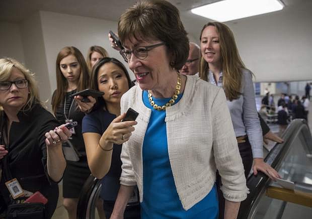 Sen. Susan Collins, R-Maine is surrounded by reporters as she heads to the Senate on Capitol Hill in Washington, Thursday, July 27, 2017, while the Republican majority in Congress remains stymied by their inability to fulfill their political promise to repeal and replace &quot;Obamacare&quot; because of opposition and wavering within the GOP ranks. (AP Photo/J. Scott Applewhite)