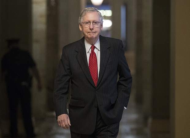 Senate Majority Leader Mitch McConnell of Ky. walks from his office to the Senate floor on Capitol Hill in Washington, Wednesday, July 26. (AP Photo/Carolyn Kaster)