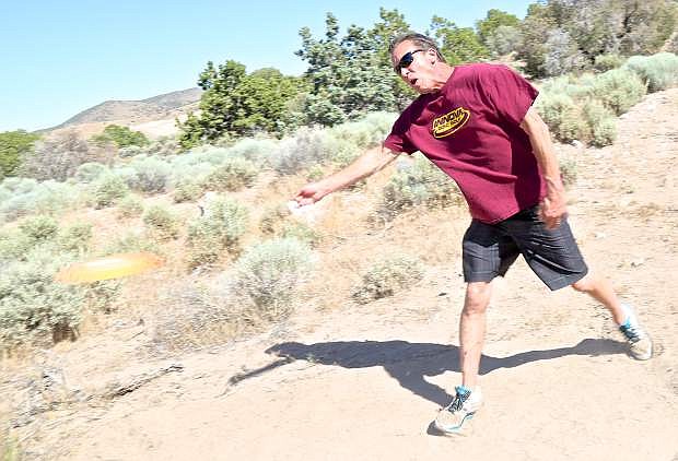 Paul Hanson &#039;tees off&#039; at the future site of the Eagle Valley Disc Golf Associations course in Carson.