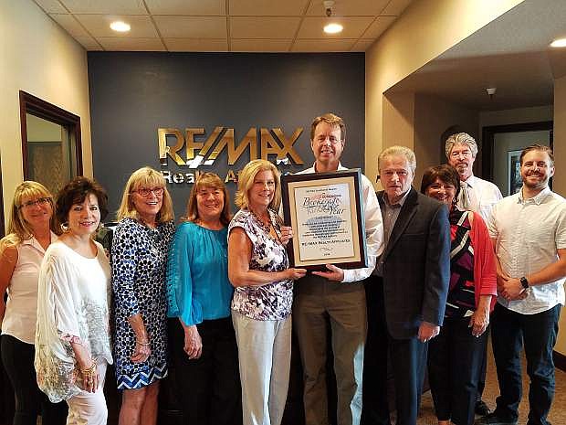 Carson City RE/MAX team proudly displays their Brokerage of the Year Award for 2016, recieved in April.