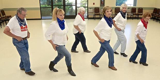 Roger Haynes, Linda Haynes, Teryl Asikainen, Pat Anderson, Sandra Lee and Lori Dias rehearse a dance Wednesday evening in preparation for the Senior Follies slated for July 14-16.