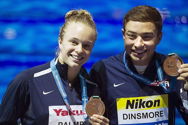 Bronze medalist Krysta Palmer and David Dinsmore of the US pose with their medals during the medal ceremony of the synchronised swimming mixed duet technical final of FINA Swimming World Championships 2017 in Duna Arena in Budapest, Hungary, Tuesday, July 18, 2017. (Tibor Illyes/MTI via AP)
