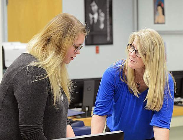 Western Nevada College graphics communications Instructor Jayna Conkey works with student Megan Lynch, of Carson City, in class on May 16, 2016.