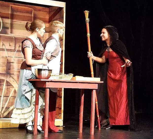 A scene from &quot;Into the Woods, Jr.&quot; featuring Kamryn Main as Baker&#039;s Wife, Cameron Miller as Baker, Serena Dantzler as The Witch.