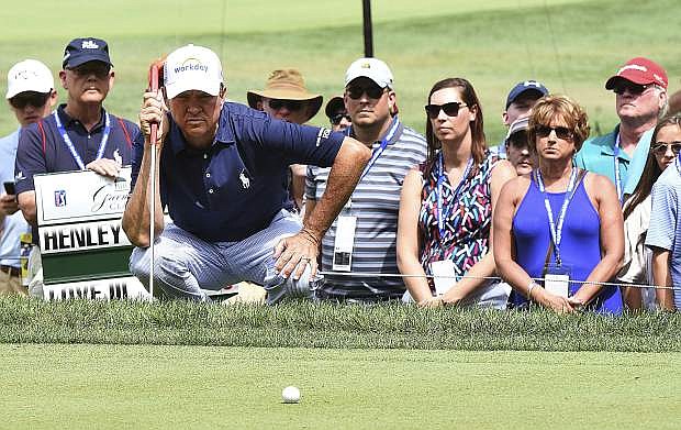 Davis Love III looks over his putt on the ninth hole during the third round of The Greenbrier Classic golf tournament on July 8 in White Sulphur Springs, W.Va.