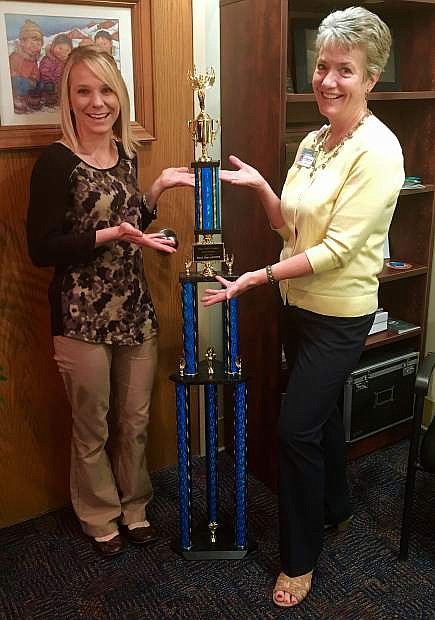 From left, Carson Tahoe Health representatives Samantha Thompson Laurie Burt display the winning trophy for this year&#039;s Hopefest competition.