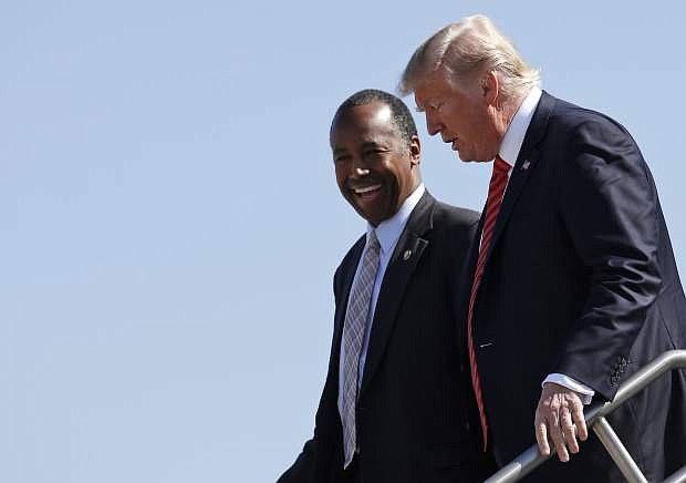 President Housing and Urban Development Secretary Ben Carson step off Air Force One upon their arrival in Reno, Nev., Wednesday, Aug. 23, 2017. (AP Photo/Alex Brandon)Donald Trump and