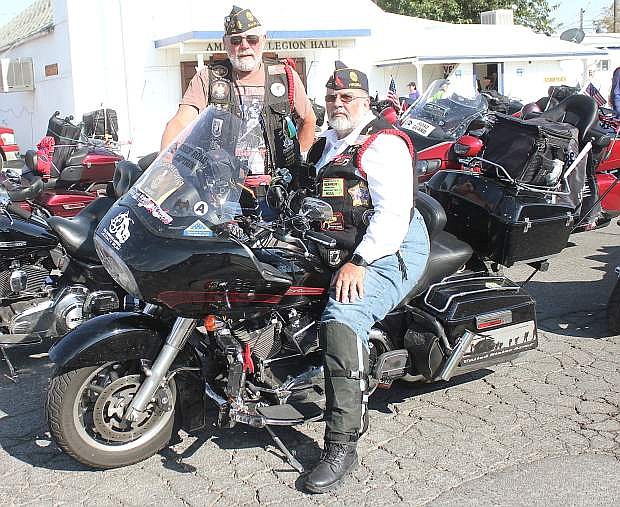 Bob Sussan, right, and James Cowley set up their bikes before heading into dinner with the Legion Riders.
