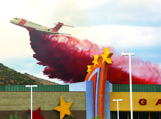 A jet tanker drops retardant on the Voltaire fire Tuesday afternoon.