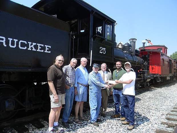 From left, Dennis Bargman of the Inliners International; Bill Ramsden of Packards International and also Host of Friendship Day; Al Abrahamson of the Horseless Carriage Club of Nevada; Barry Simcoe, President of the Friends of the Nevada State Railroad Museum; Dan Thielen, Director of the Nevada State Railroad Museum; Adam Michalski, Curator of Education of the Nevada State Railroad Museum and Gary Butrick of the AACA giving Barry Simcoe the check.