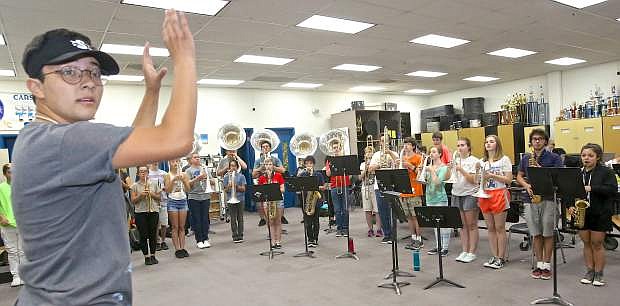 Drum Major Tobias Arreola directs the Carson High Band during practice Wednesday at CHS.