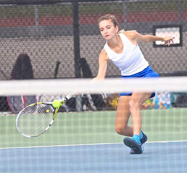 Carson sophomore Becca Trejo reaches for a shot against her Galena opponent Brooke Galloway Thursday at CHS.