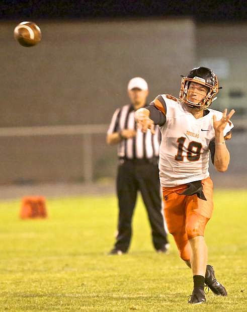 Douglas quarterback Hunter Hickey fires the ball to a Douglas receiver at North Valleys Friday night.