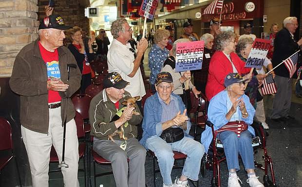 A welcoming committee of veterans wait for the Honor Flight Nevada travelers. From left are Gary Mouck, Ed Gero, Jack Brantley and Peanut, Jimmie Monsoor and Marilyn Monsoor.