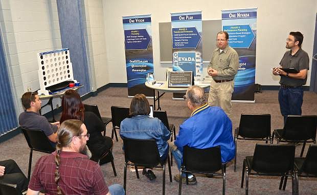 NDOT long range planner Tim Mueller and NDOT consultant Devin Crowley speak about the One Nevada Plan Wednesday night at the community center.