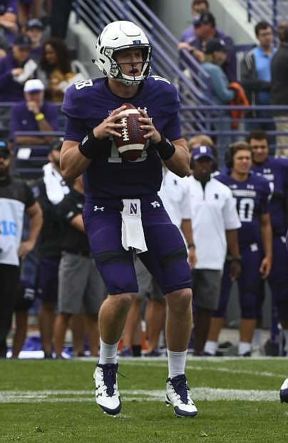 Northwestern quarterback Clayton Thorson (18) looks to throw against Nevada during the first half of an NCAA college football game in Evanston, Ill., Saturday, Sept. 2, 2017. (AP Photo/Matt Marton)