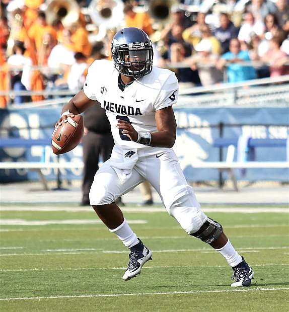 Nevada quarterback Kaymen Cureton tries to find an open receiver against Idaho State.