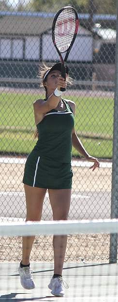 Brynlee Shults reaches to return the ball during a match at the CCHS tennis court.
