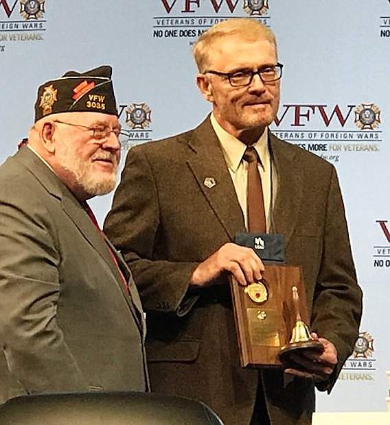 Senior Vice Commander in Chief Keith Harmon, left, presents the Teacher of the Year Award to Fallon educator Steve Johnson at the National VFW convention in New Orleans.