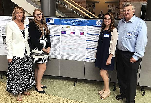 From left, WNC Fallon campus Professor Holly O&#039;Toole, research students Ellona Gehman and Lana Quint, and WNC&#039;s Dr. Gary Evett present their research group&#039;s scientific poster at the 2nd Annual NIH INBRE Statewide Meeting at UNLV.