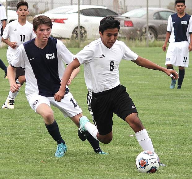 Bryan Duenas, right, takes possession of the ball against North Tahoe.