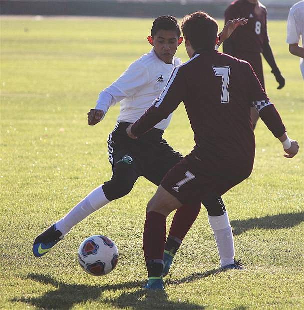 Bryan Ugalde spars with Elko&#039;s player Saturday morning.