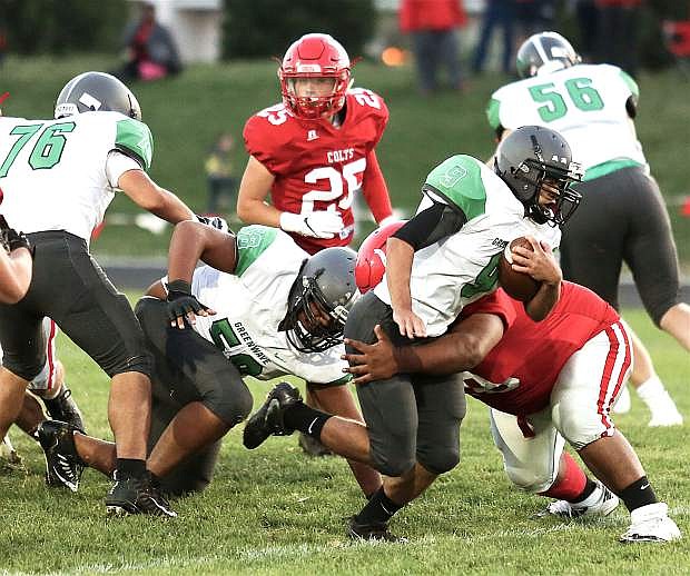 Fallon junior running back Reid Clyburn powers through the Wooster defense in the first half.