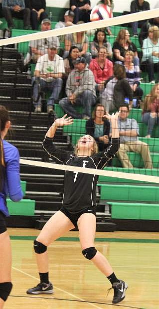 Shelbi Schultz sets the ball for a kill against South Tahoe.