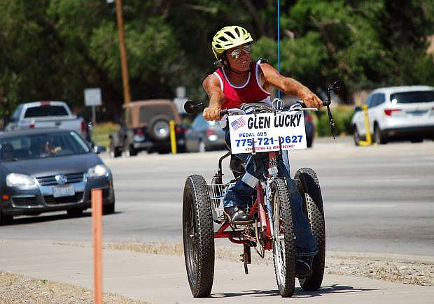 Glen Lucky rides his tricycle near the intersection of Fairview Drive and Carson Street on Monday, July 3, 2017. Guy Clifton/Travel Nevada
