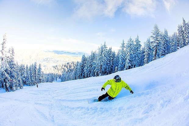 A snowboarder cruises through fresh powder last season at Sierra at Tahoe.