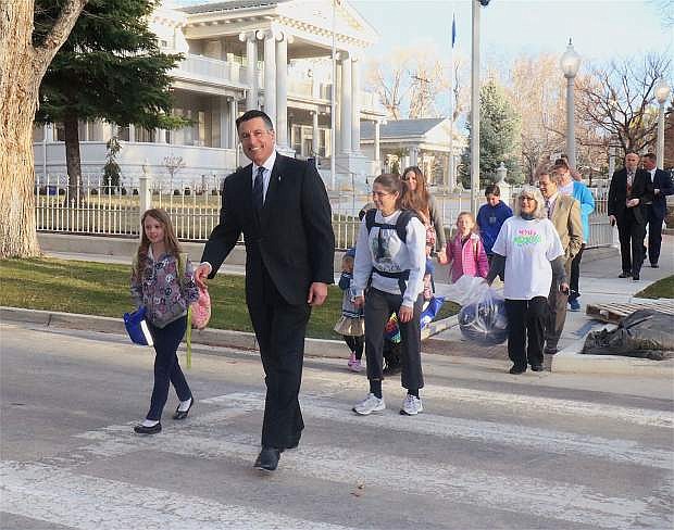 Gov. Brian Sandoval enjoys a morning walk to school with Bordewich Bray Elementary School with students and faculty in 2017.