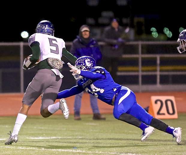 Abel Carter stretches to bring down a Damonte receiver Friday night at CHS.