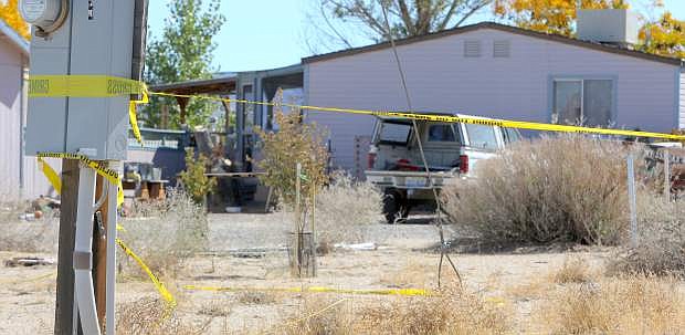 Crime scene tape still surrounds a home on East Third Street in Silver Springs on Monday after two bodies were discovered by local authorities on Saturday night.