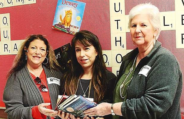 From left are M. J. Dodson, Cottonwood Elementary School Librarian Elizabeth Sabo and Literacy Chair Peggy Gray.