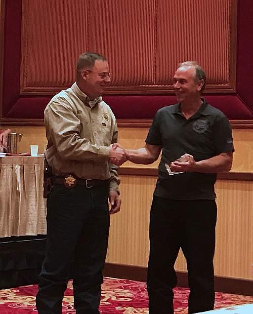 Carson City Sheriff Kenny Furlong is presented with an award by Lyon County Sheriff Al McNeil on Monday night.
