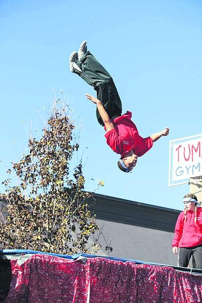 The high flying acrobatics of Tumbleweeds Gymnastics during the Nevada Day Parade, Carson City, NV