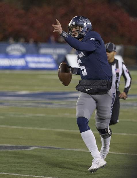 Nevada quarterback Ty Gangi scrambles during the first half of an NCAA college football game against Air Force in Reno, Nev., Friday, Oct. 20, 2017. (AP Photo/Tom R. Smedes)
