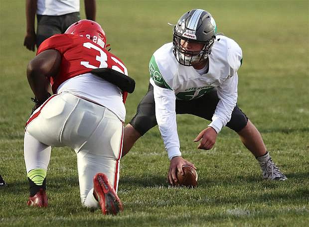 Fallon&#039;s Gabe Hardy prepares to snap the ball against Wooster.