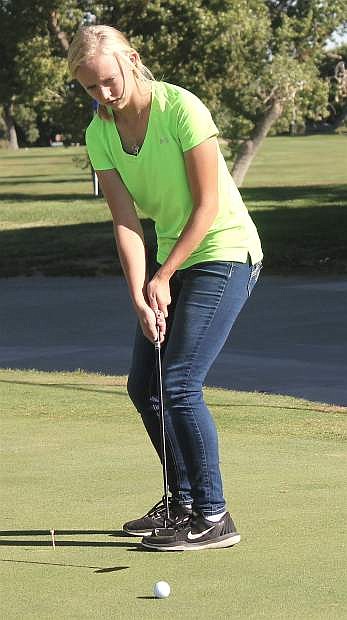 Allie Lister practices putting at the Fallon Golf Course. During the state tournament she broke 100 for a new personal best.