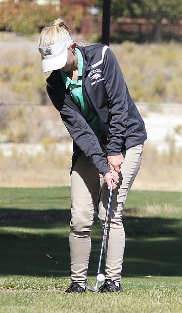 Ally Lister hits the ball toward the green during the 3A Regional Golf Tournament in Fallon.