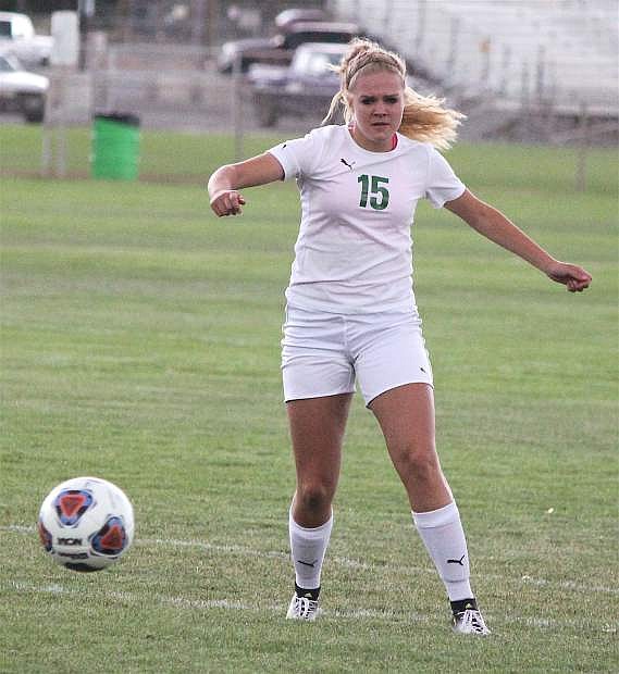 Chandler McAlexander prepares to kick the ball as it comes toward her.