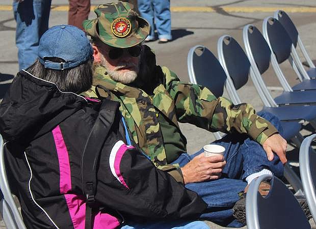 Ronald Coleman, right, who served in the U.S. Marine Corps during the Vietnam War, talks to a fellow veteran.
