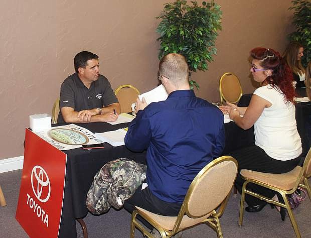 Tim Mitchell, general manager of Fallon Ford-Toyota, talks to interested applicants at a previous job fair.