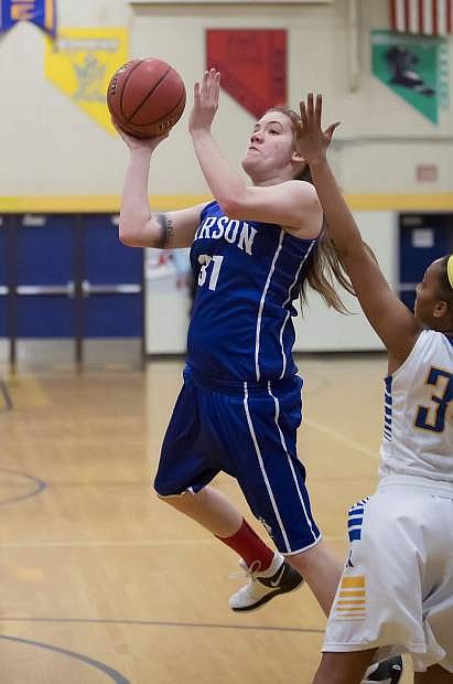 Haley Garver takes the ball to the basket for Carson.