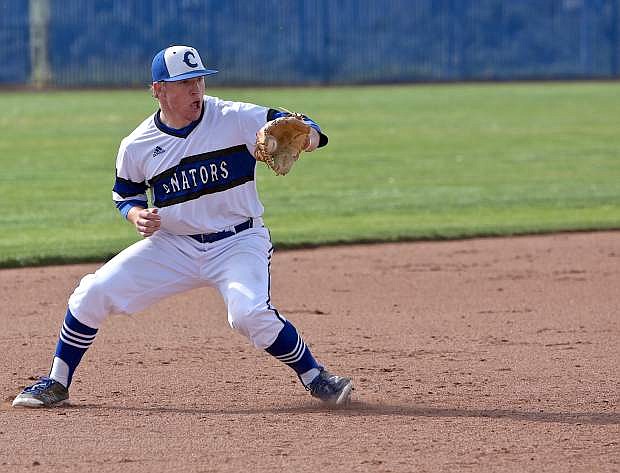 Third baseman Abel Carter grabs a grounder last season in a playoff game against Damonte Ranch.