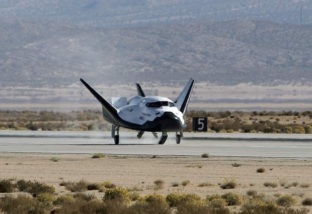 This Nov. 11, 2017 photo provided by Sierra Nevada Corporation shows the Dream Chaser spacecraft landing after a test flight at Edwards Air Force Base, Calif. The Sierra Nevada Corp. says its Dream Chaser had a successful free-flight drop test in the Mojave Desert on Saturday, Nov. 11, 2017. (Ken Ulbrich/NASA via AP)