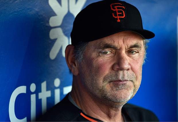 This Aug. 2, 2016 photo shows San Francisco Giants manager Bruce Bochy in the dugout prior to a baseball game against the Philadelphia Phillies in Philadelphia. Bochy has been admitted to a Miami hospital after falling ill and will miss the game against the Marlins on Monday, Aug. 8, 2016. (AP Photo/Derik Hamilton)